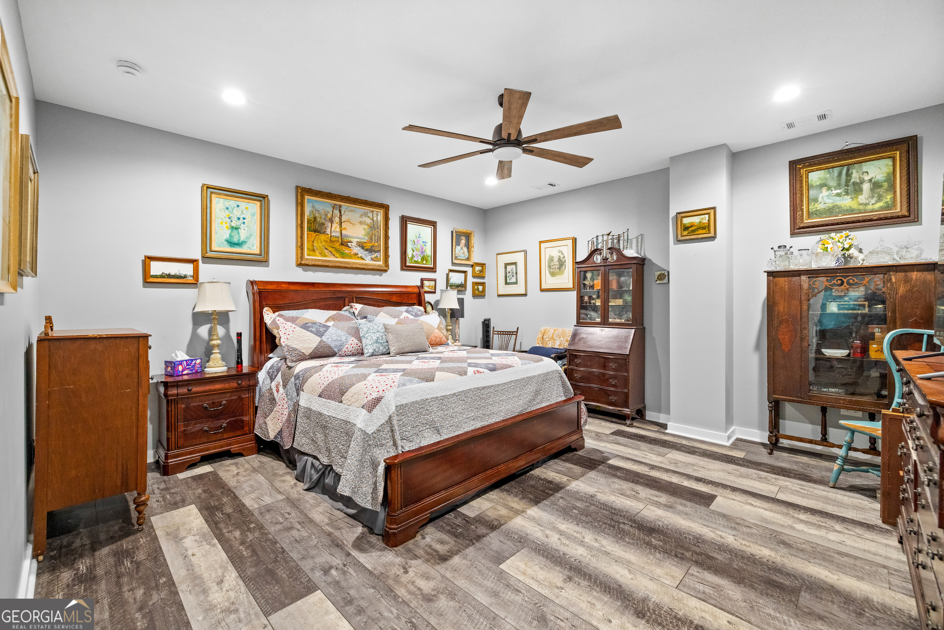 2109 Brewers Mill Road Elberton, GA 30635 - Photo 12 of 51 a spacious bedroom with a bed and wooden floor