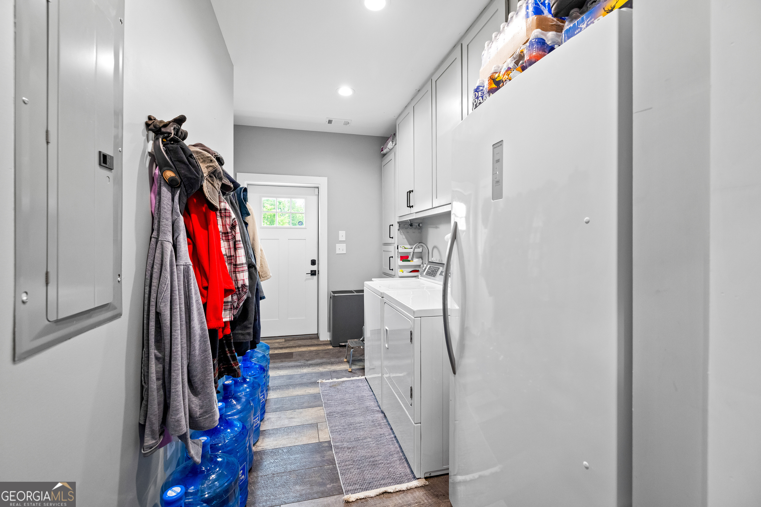 2109 Brewers Mill Road Elberton, GA 30635 - Photo 23 of 51 a view of a storage and utility room with washer and dryer