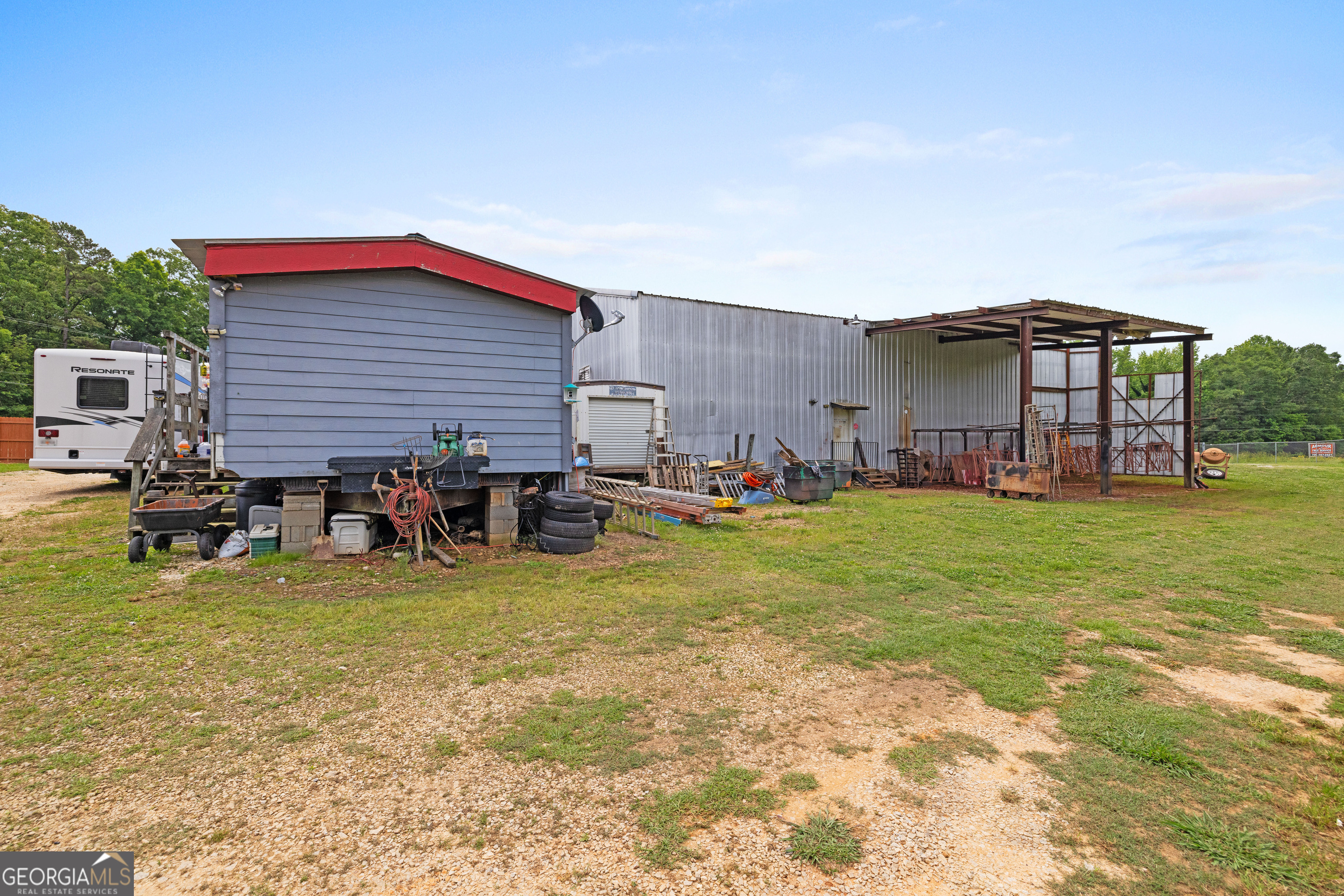 2109 Brewers Mill Road Elberton, GA 30635 - Photo 27 of 51 a view of a house with a yard and sitting area