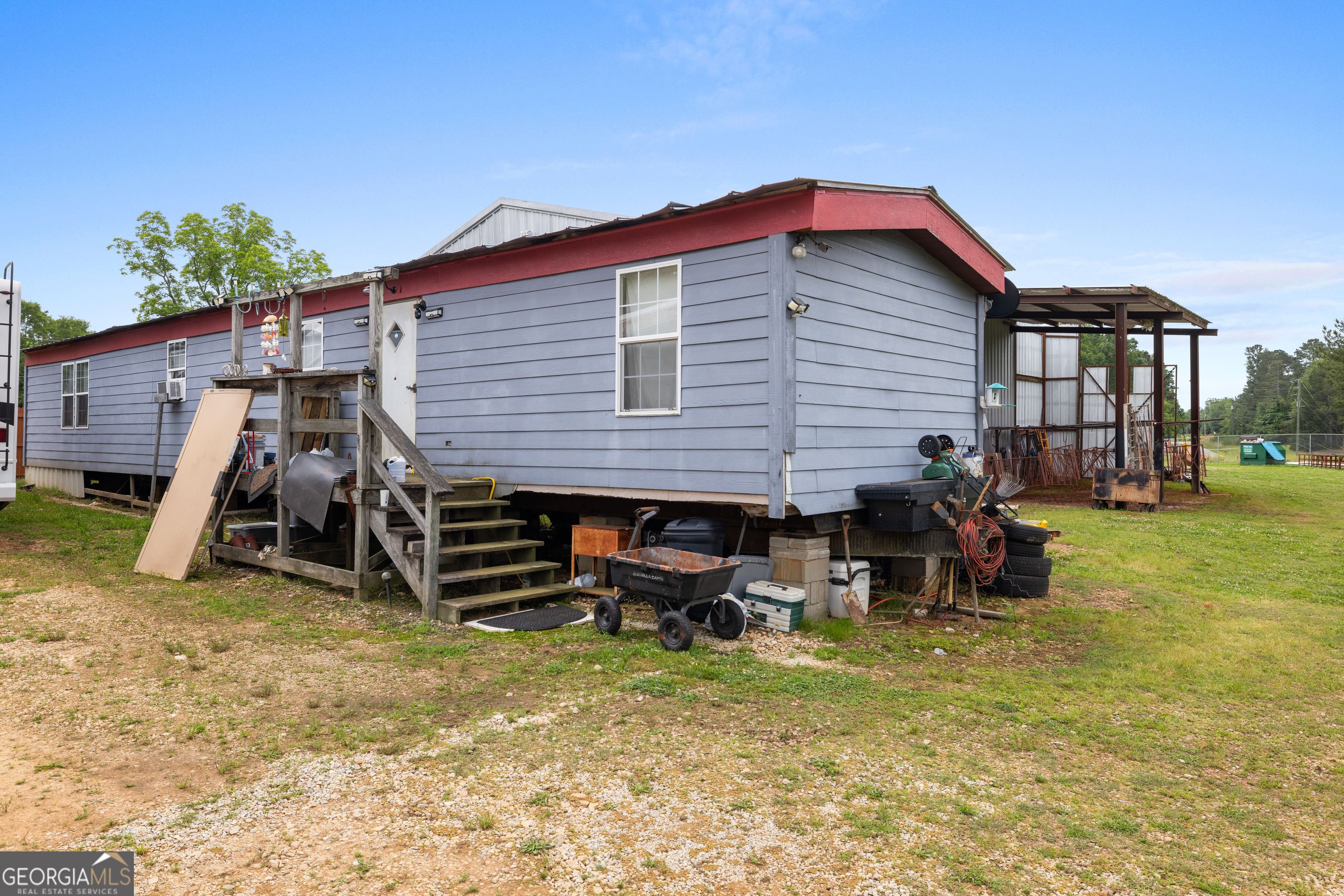 2109 Brewers Mill Road Elberton, GA 30635 - Photo 32 of 51 a view of a house with a yard and furniture