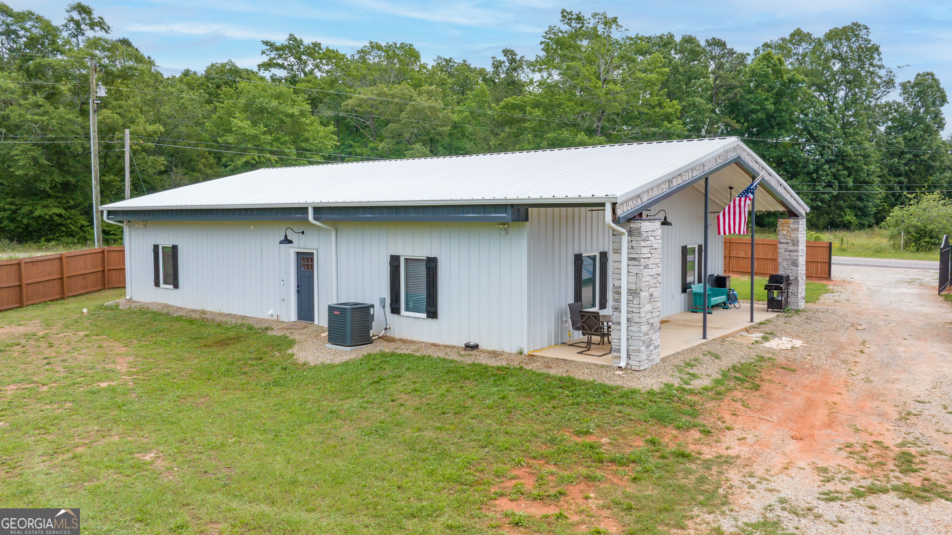 2109 Brewers Mill Road Elberton, GA 30635 - Photo 35 of 51 a front view of a house with garden