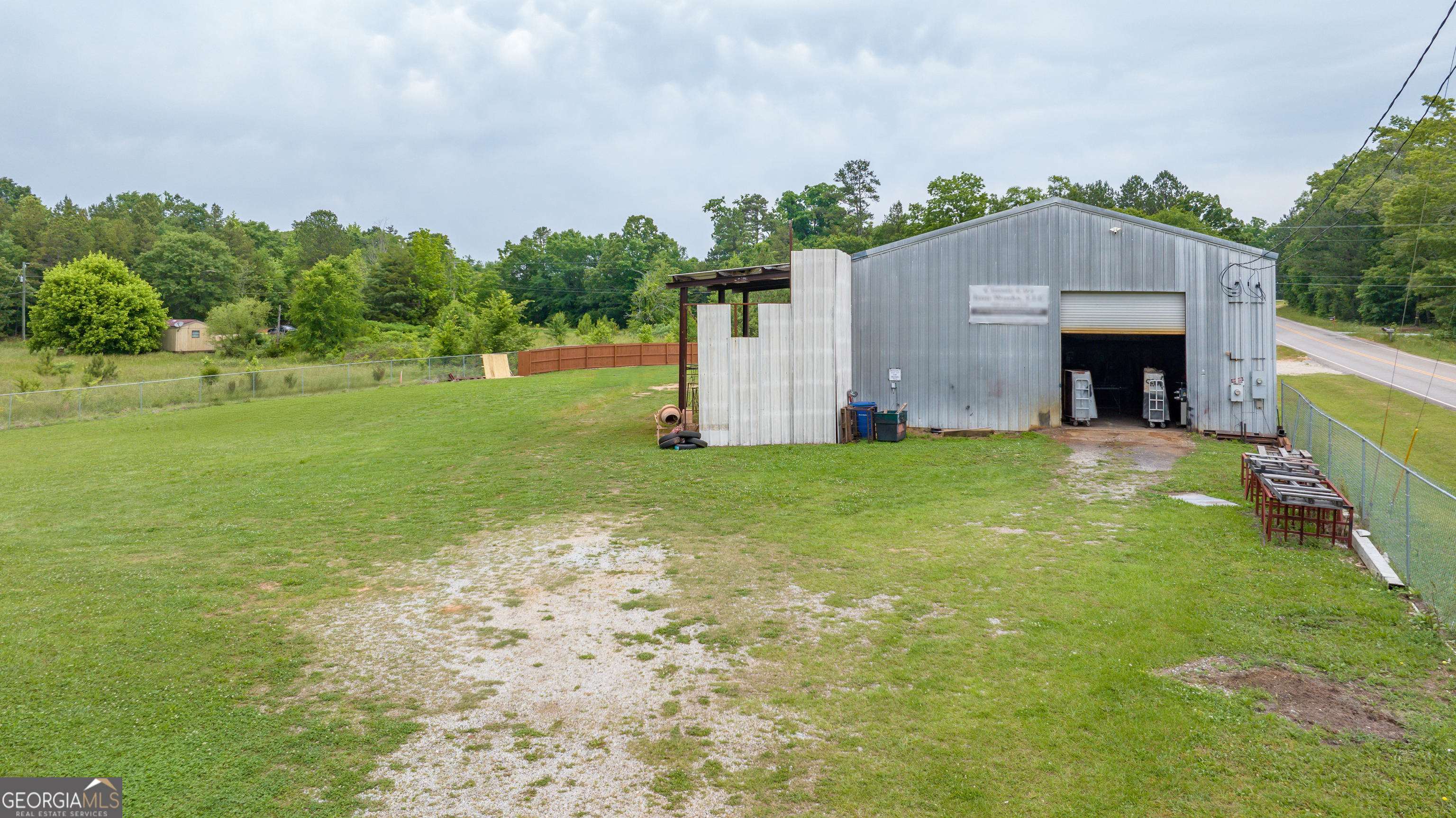 2109 Brewers Mill Road Elberton, GA 30635 - Photo 36 of 51 a view of a house with a yard and garage