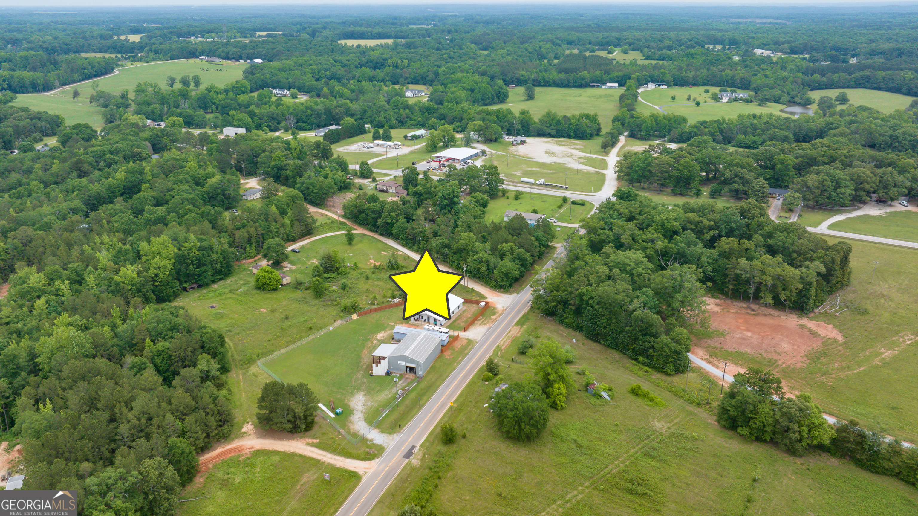 2109 Brewers Mill Road Elberton, GA 30635 - Photo 49 of 51 an aerial view of a house with a swimming pool