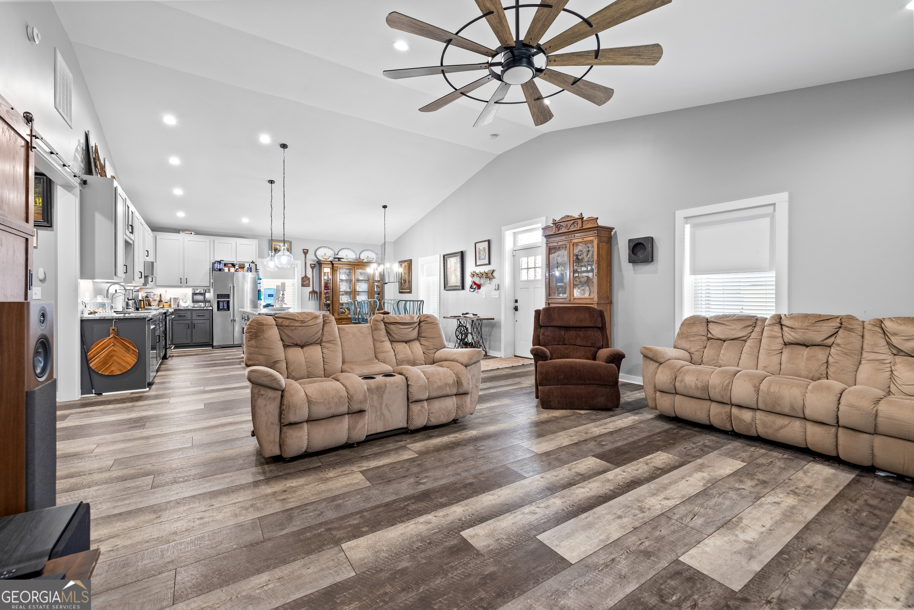 2109 Brewers Mill Road Elberton, GA 30635 - Photo 7 of 51 a living room with furniture and a chandelier