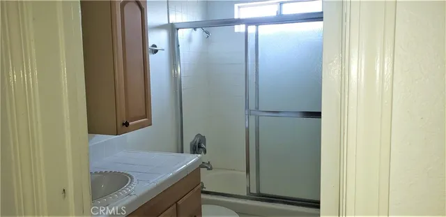 a kitchen with stainless steel appliances a refrigerator and a stove