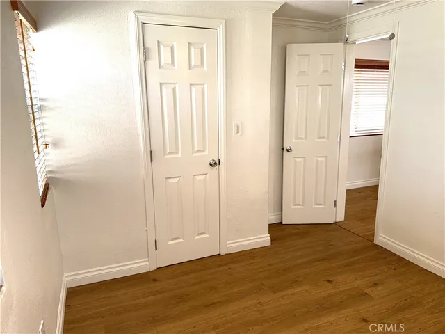 a view of a bathroom with wooden floor