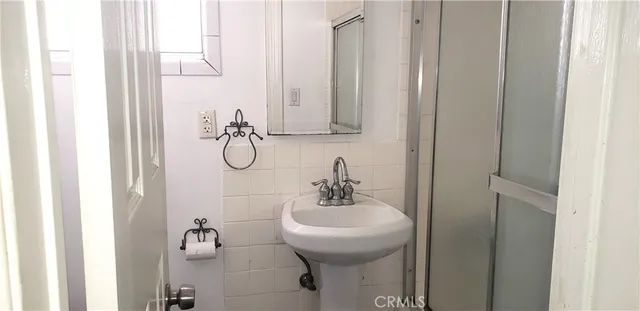 a view of a bathroom from a hallway