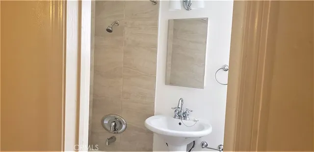 a kitchen with a refrigerator and a stove