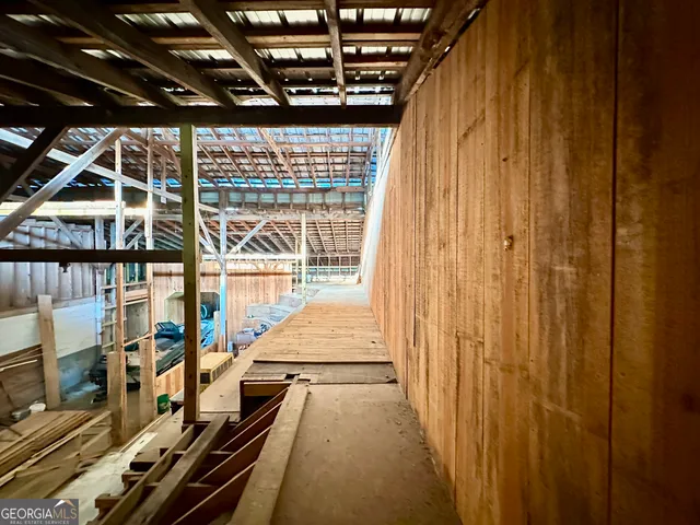 a view of a balcony with wooden floor