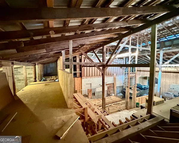 a view of a patio with table and chairs with wooden floor