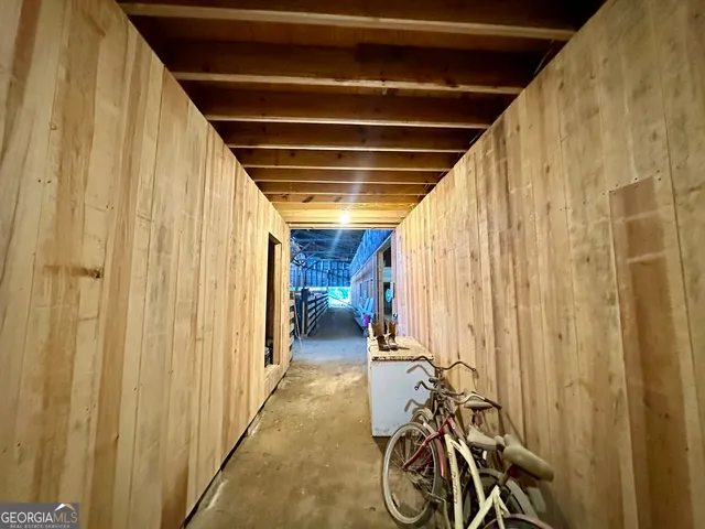 a view of entryway with wooden walls