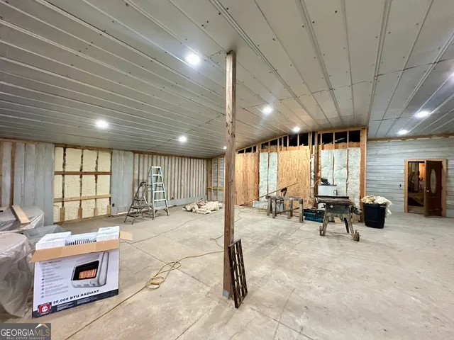 a group of chairs sitting in a room next to a window