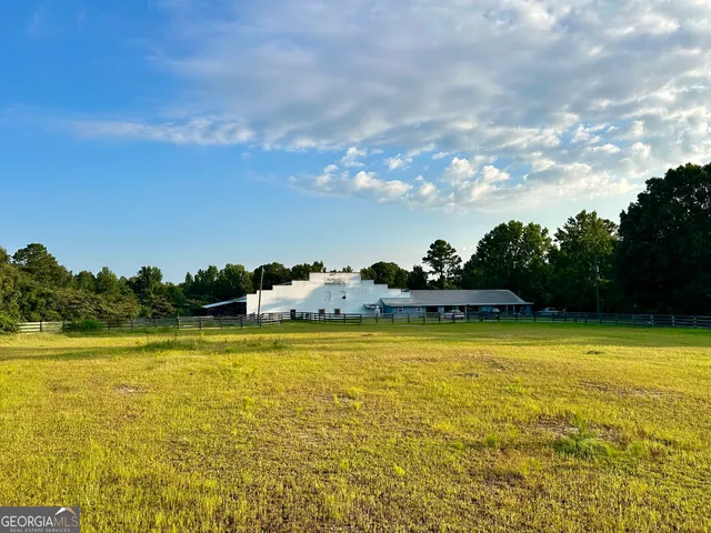 a view of a swimming pool and an outdoor seating