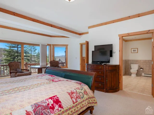 a bedroom with a bed and a fireplace