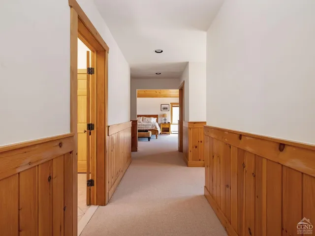 a bedroom with a bed and flat screen tv