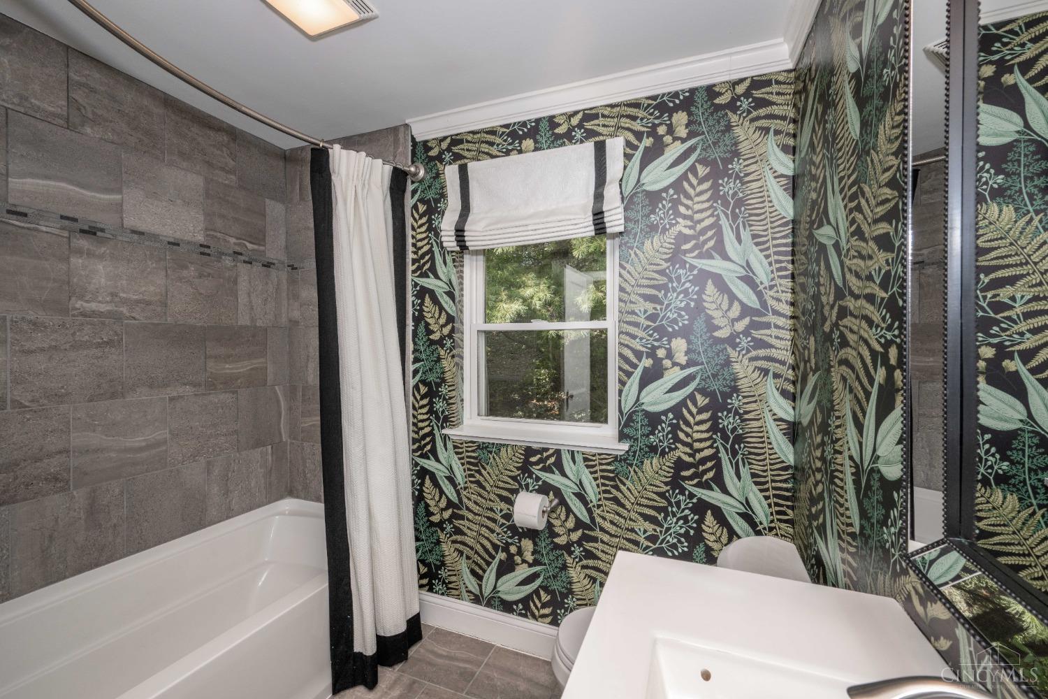 7396 Dawson Road Madeira, OH 45243 - Photo 20 of 42 The seller installed a shower rod that can be rotated to create more room in the shower when needed and rotated back when not!