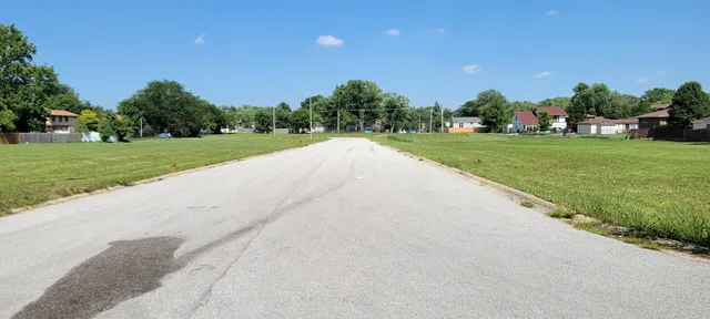 a view of building with outdoor space and trees