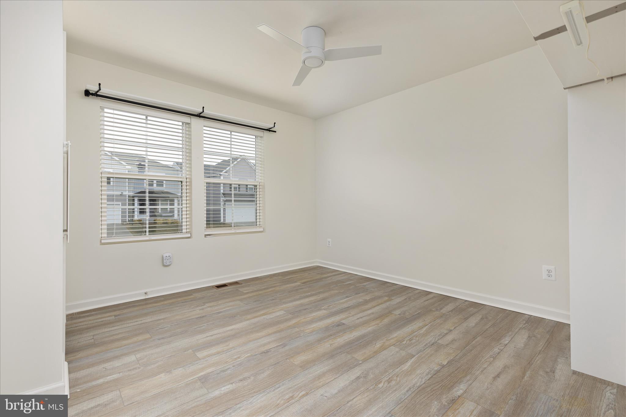 250 Stager Avenue Falling Waters, WV 25419 - Photo 15 of 31 a view of an empty room with wooden floor and a window