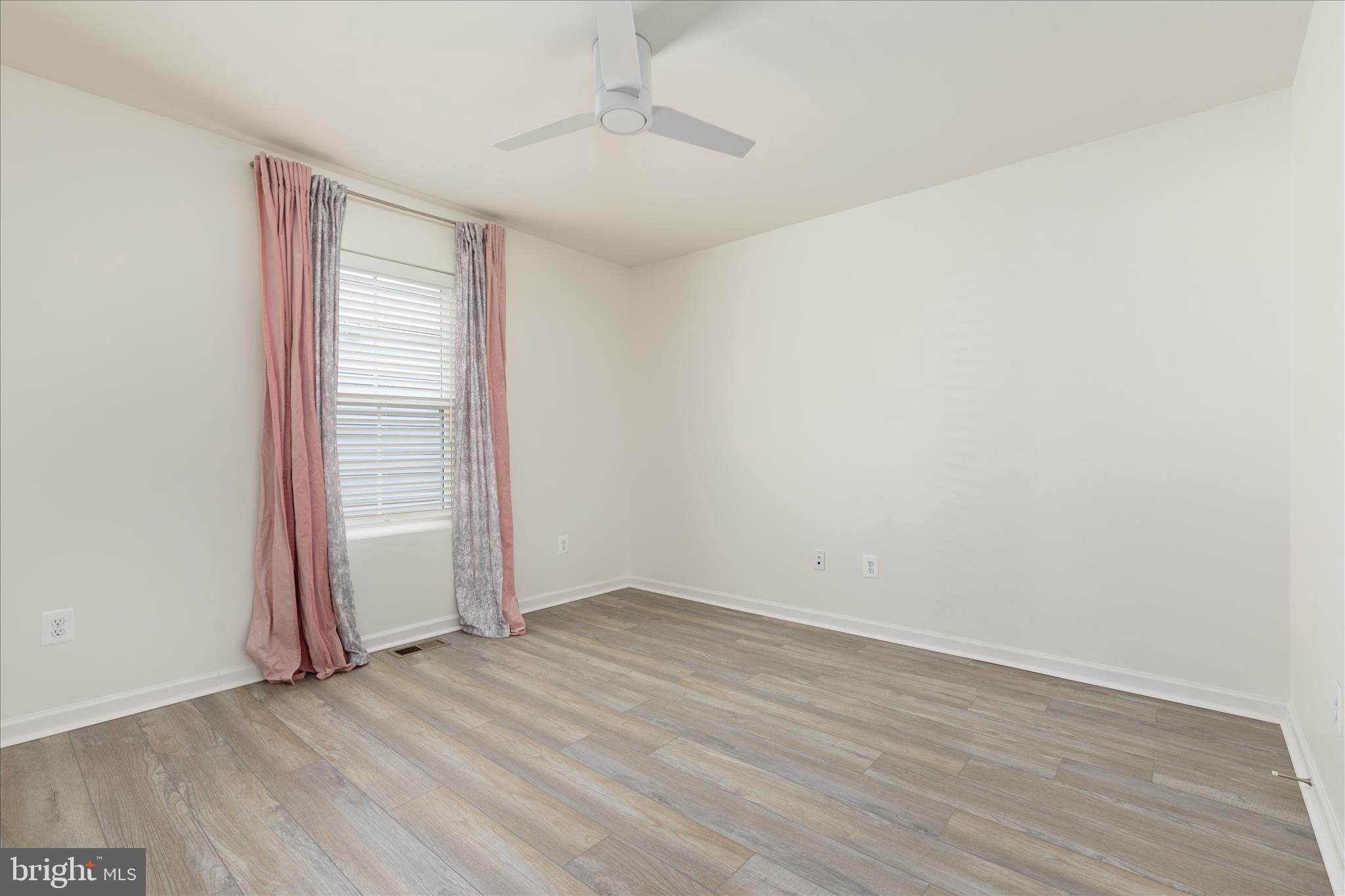 250 Stager Avenue Falling Waters, WV 25419 - Photo 16 of 31 an empty room with wooden floor and windows