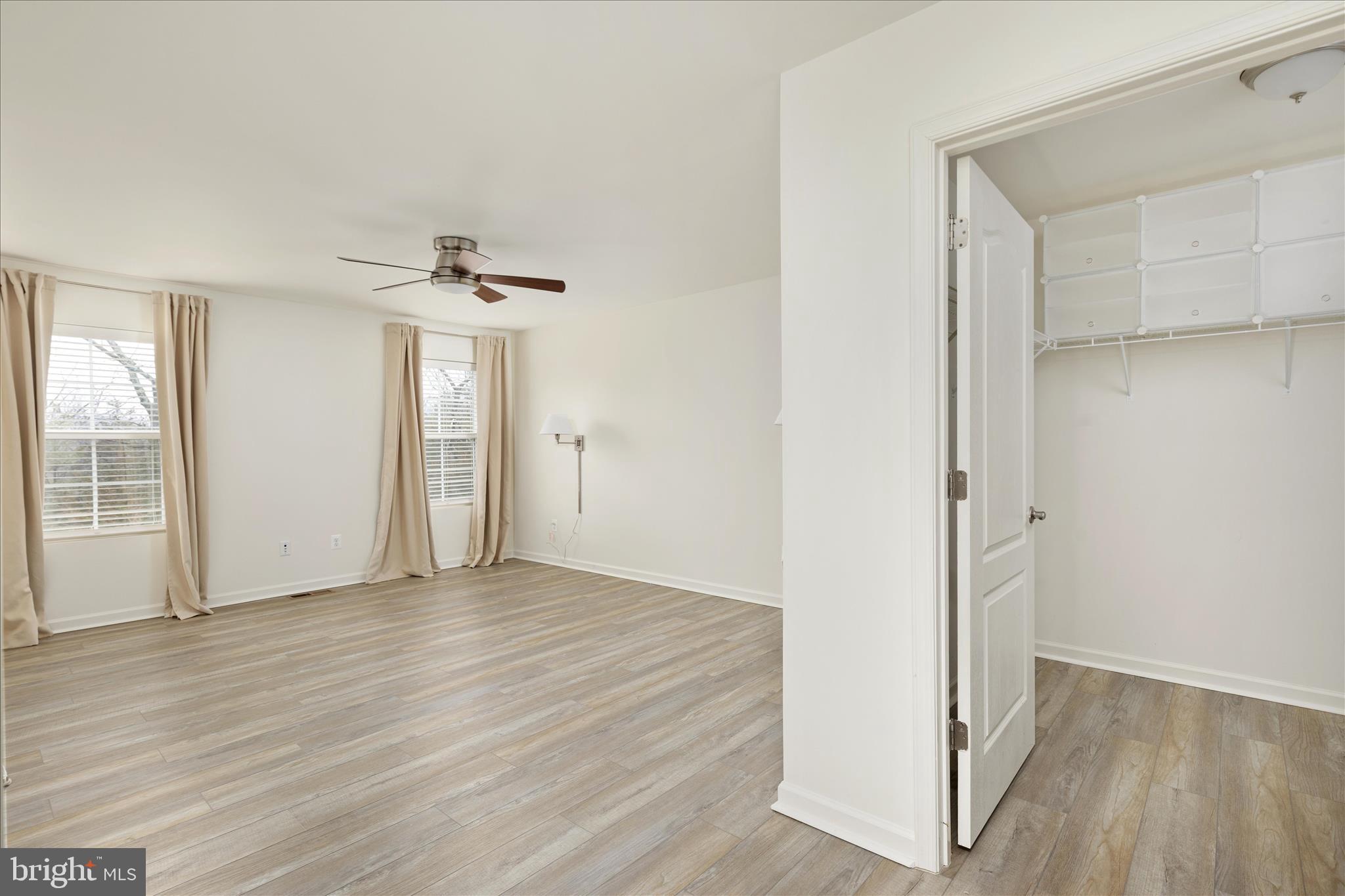 250 Stager Avenue Falling Waters, WV 25419 - Photo 18 of 31 an empty room with wooden floor and windows