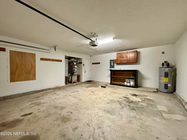 a view of empty room with a fireplace