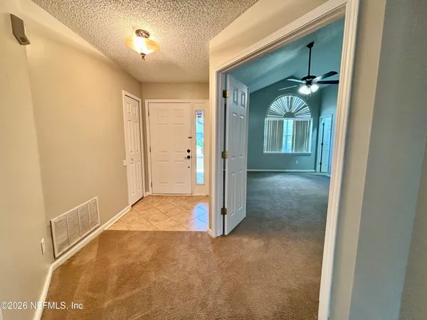 a view of entryway with a bathroom