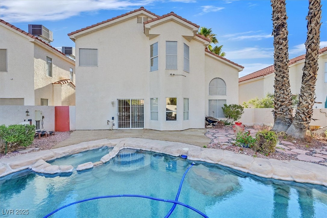 234 Highgate Street Henderson, NV 89074 - Photo 21 of 22 View of swimming pool with a pool with connected hot tub and a patio