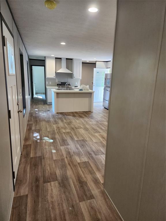 229 Maple Street Mabank, TX 75156 - Photo 11 of 25 a view of open kitchen with a sink refrigerator and window