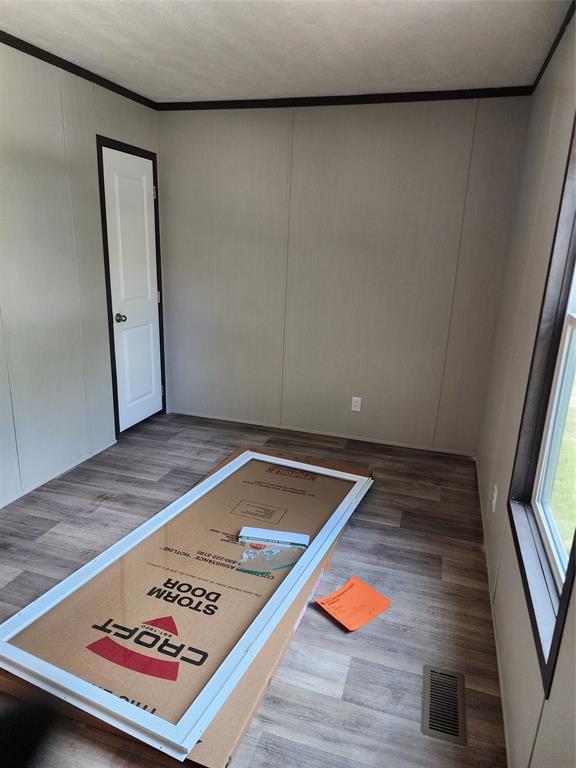 229 Maple Street Mabank, TX 75156 - Photo 13 of 25 wooden floor with a book shelf