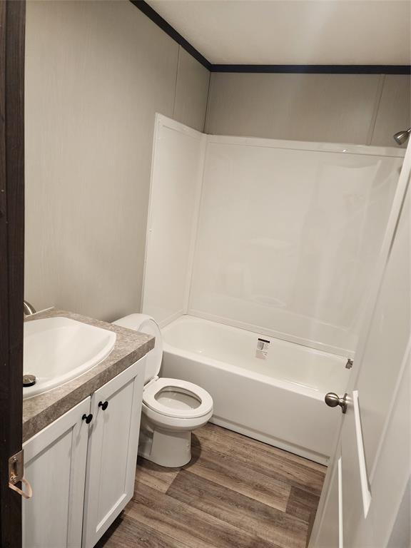 229 Maple Street Mabank, TX 75156 - Photo 14 of 25 a bathroom with a sink a toilet and a bathtub
