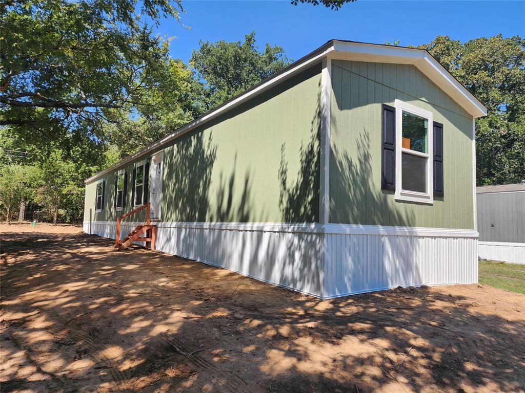 229 Maple Street Mabank, TX 75156 - Photo 2 of 25 a view of a house with a roof deck