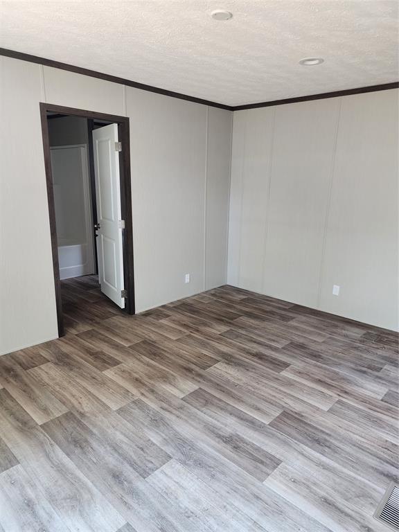 229 Maple Street Mabank, TX 75156 - Photo 24 of 25 a view of a room with wooden floor