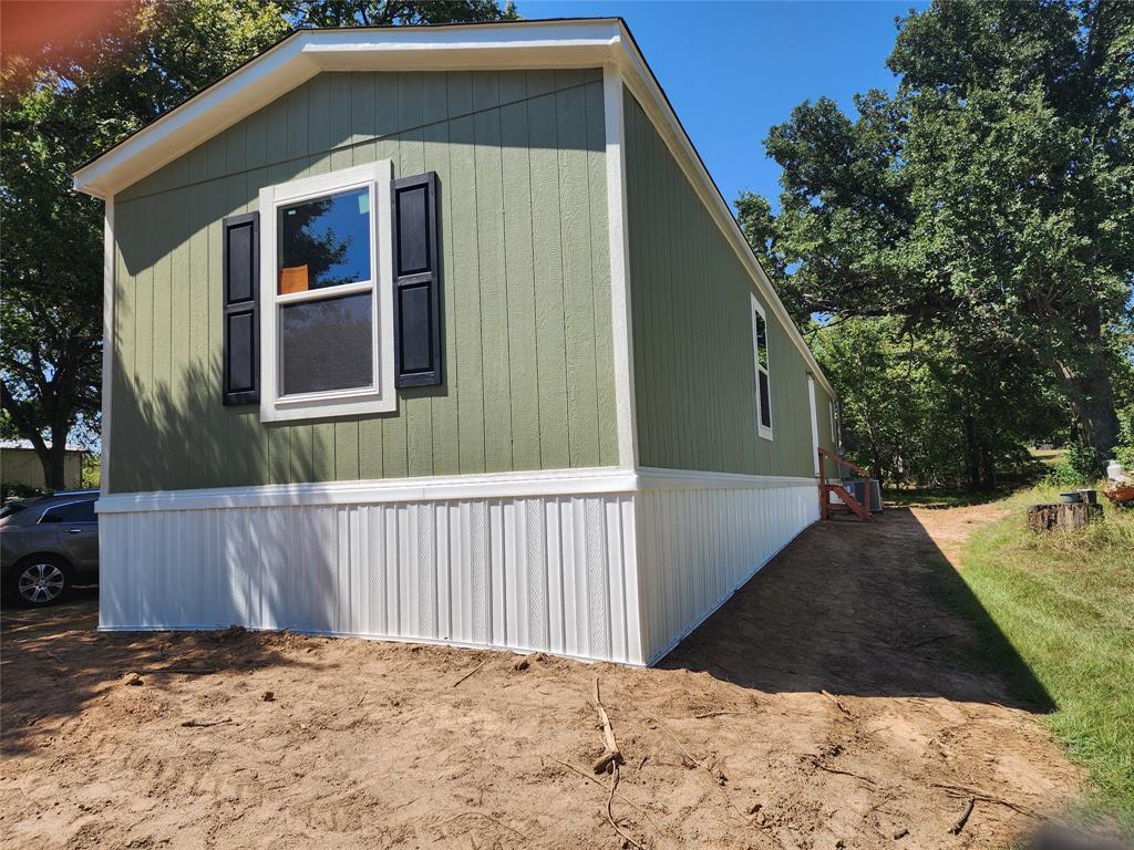 229 Maple Street Mabank, TX 75156 - Photo 3 of 25 a backyard of a house