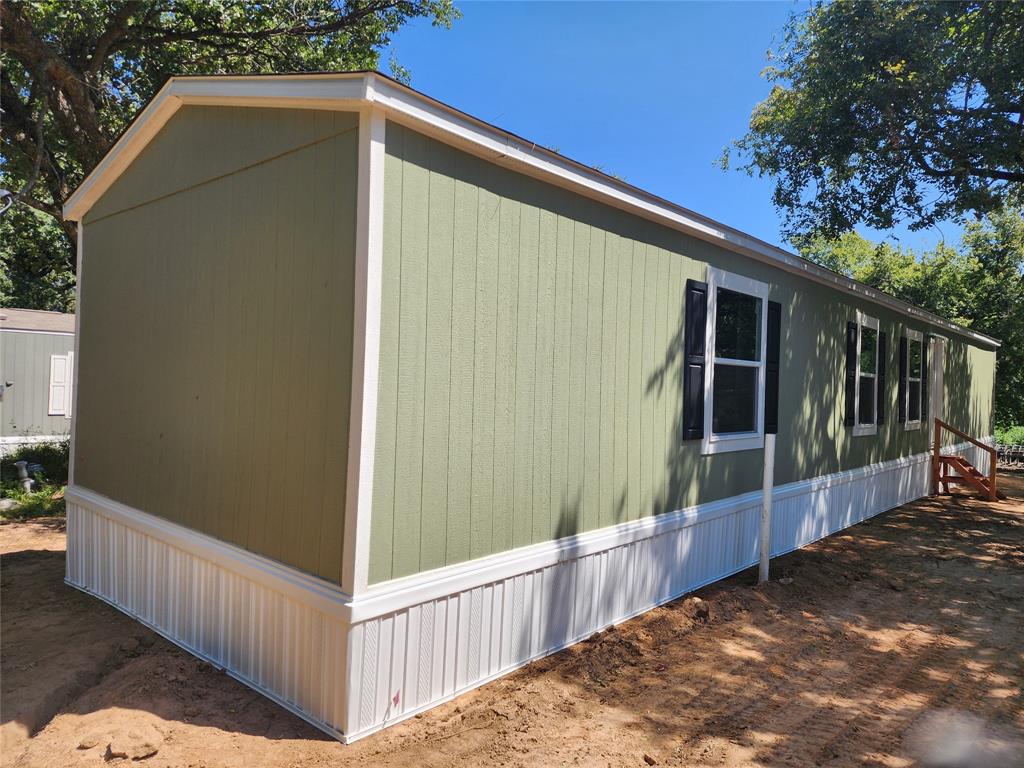 229 Maple Street Mabank, TX 75156 - Photo 6 of 25 a house view with a backyard space