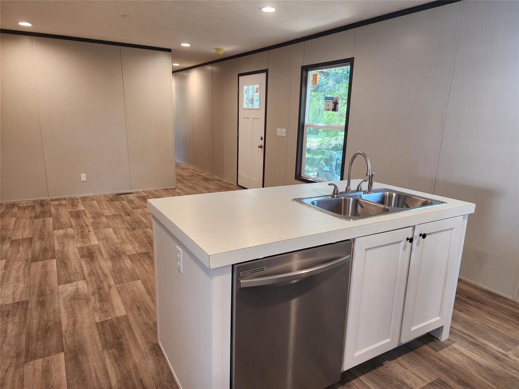 229 Maple Street Mabank, TX 75156 - Photo 8 of 25 a kitchen with a sink and cabinets