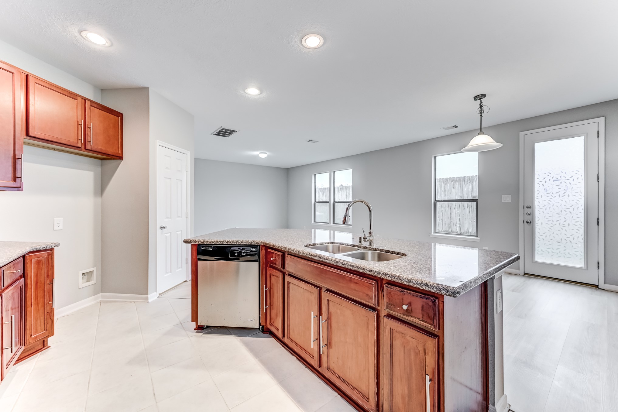 4706 Mint Trail Houston, TX 77066 - Photo 15 of 46 a kitchen with stainless steel appliances granite countertop a sink and stove