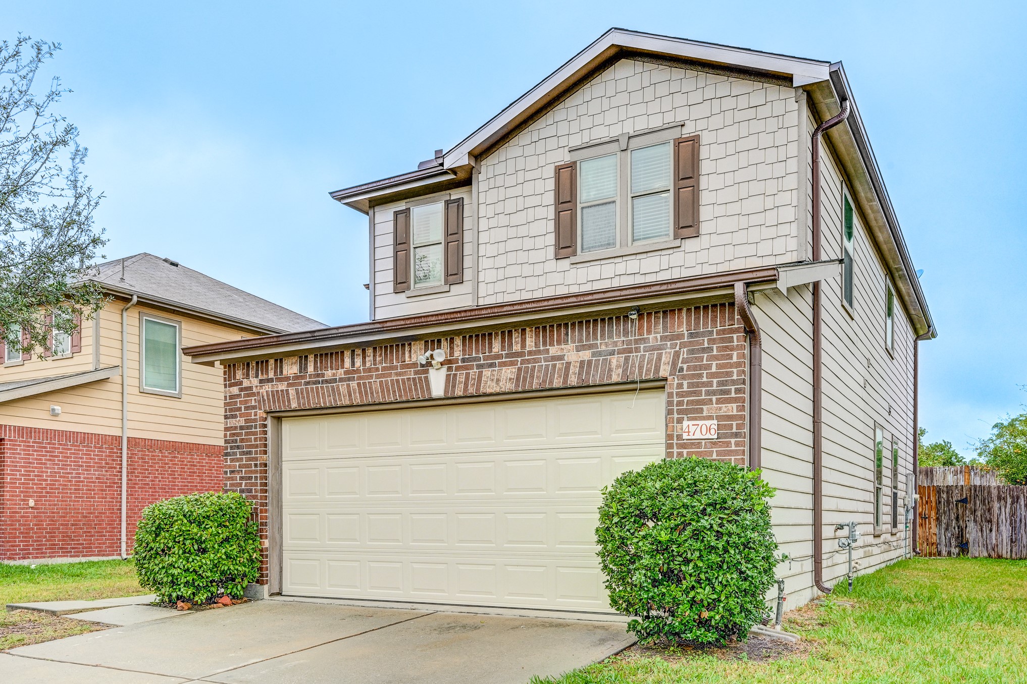 4706 Mint Trail Houston, TX 77066 - Photo 2 of 46 a front view of a house with a yard and garage