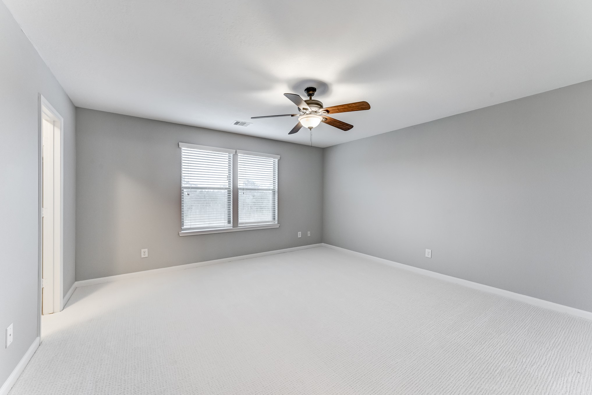 4706 Mint Trail Houston, TX 77066 - Photo 25 of 46 a view of an empty room with a window
