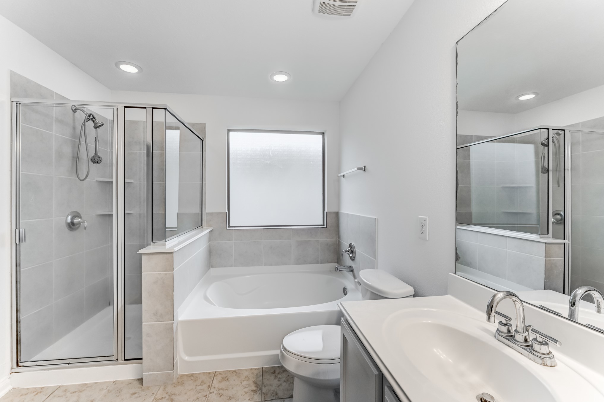 4706 Mint Trail Houston, TX 77066 - Photo 29 of 46 a bathroom with a bathtub shower sink mirror and toilet