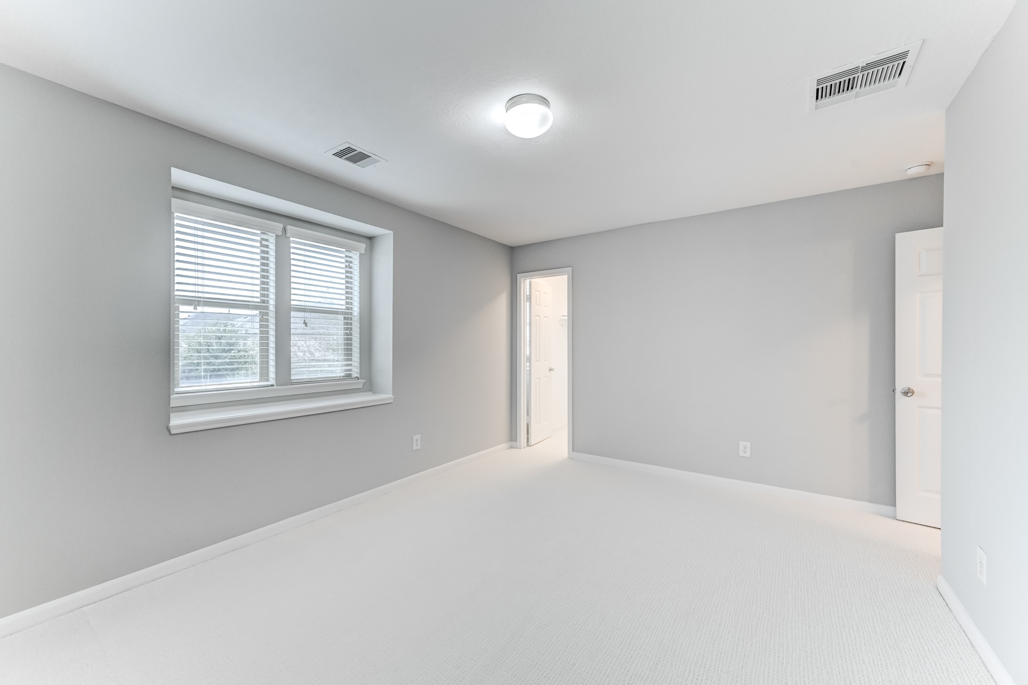 4706 Mint Trail Houston, TX 77066 - Photo 37 of 46 a view of an empty room with a window