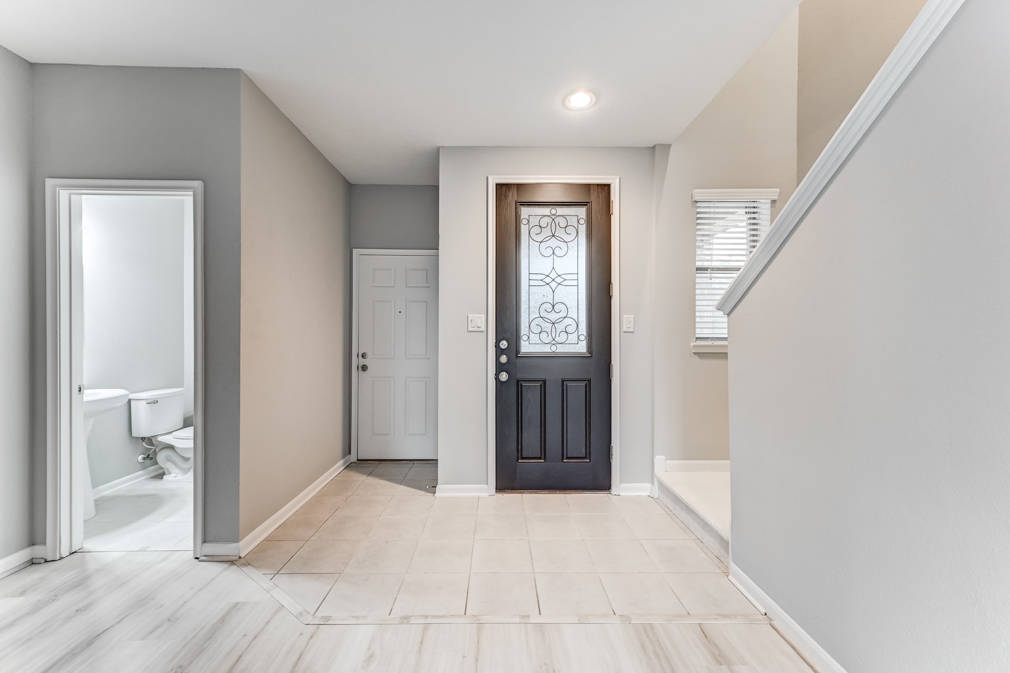 4706 Mint Trail Houston, TX 77066 - Photo 6 of 46 a view of a hallway with wooden floor and entryway