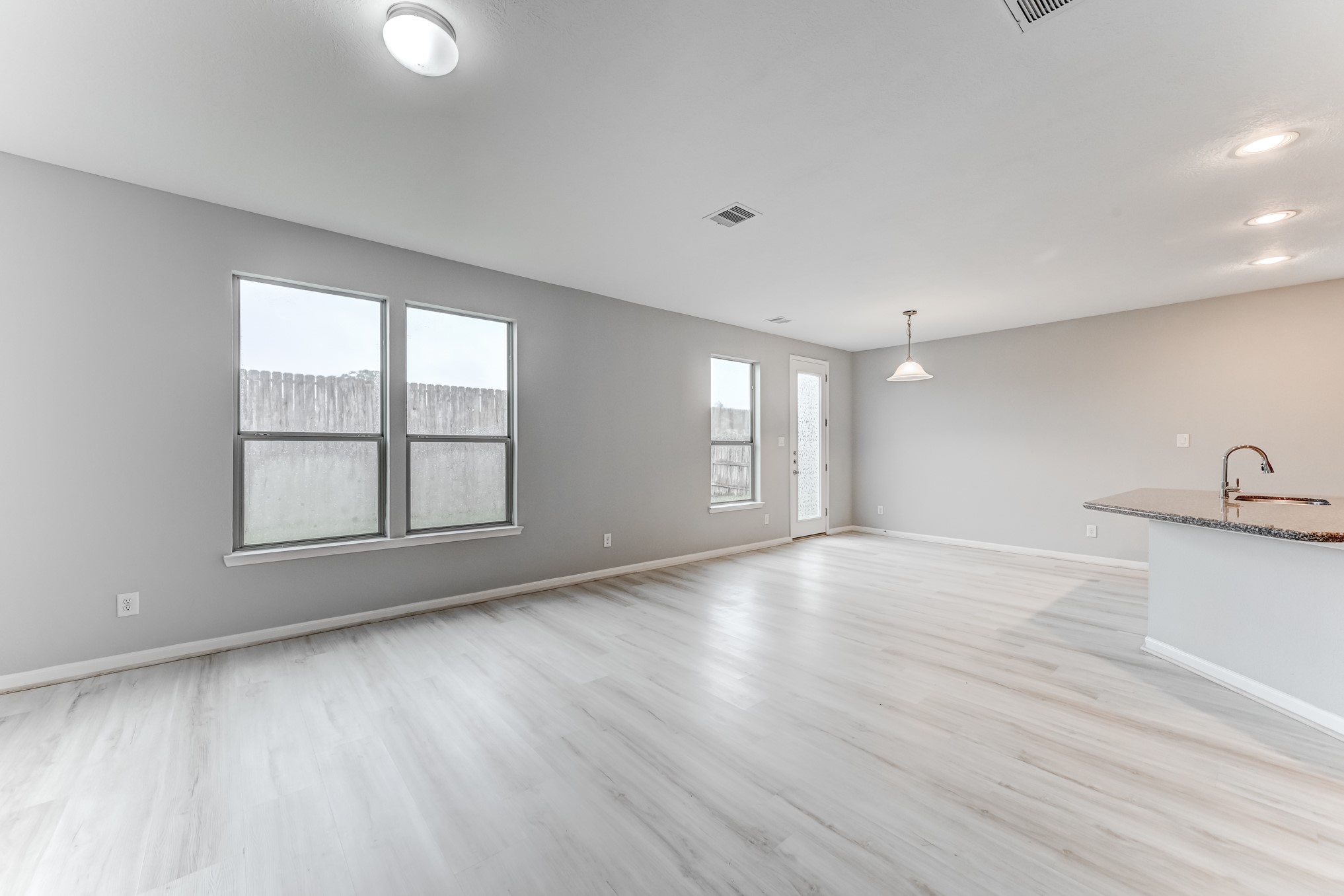 4706 Mint Trail Houston, TX 77066 - Photo 7 of 46 wooden floor in an empty room with a window