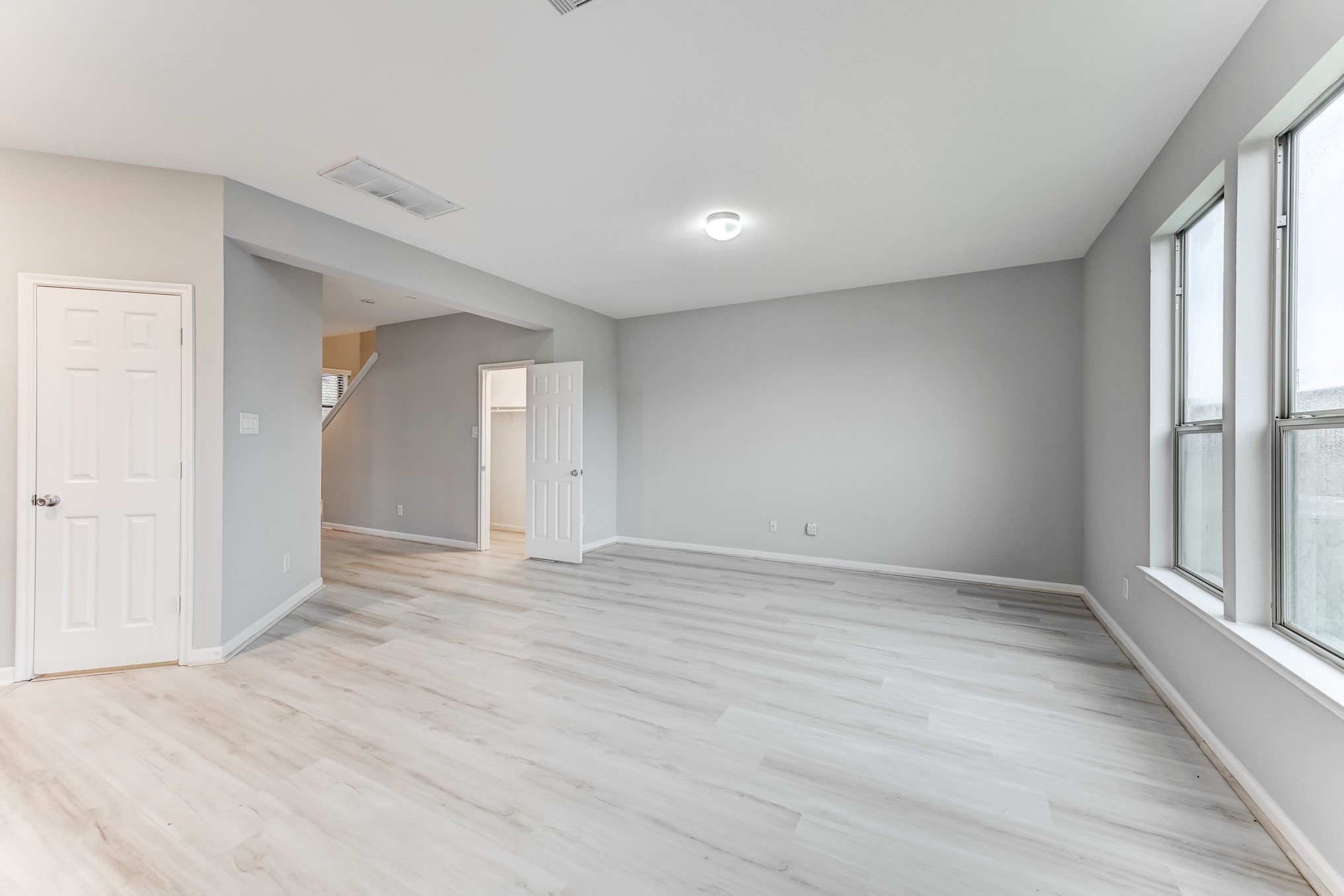4706 Mint Trail Houston, TX 77066 - Photo 8 of 46 wooden floor in an empty room with a window