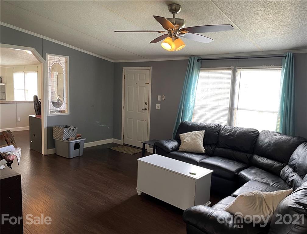 34908 Finger Road Mount Pleasant, NC 28124 - Photo 2 of 14 a living room with furniture and wooden floor