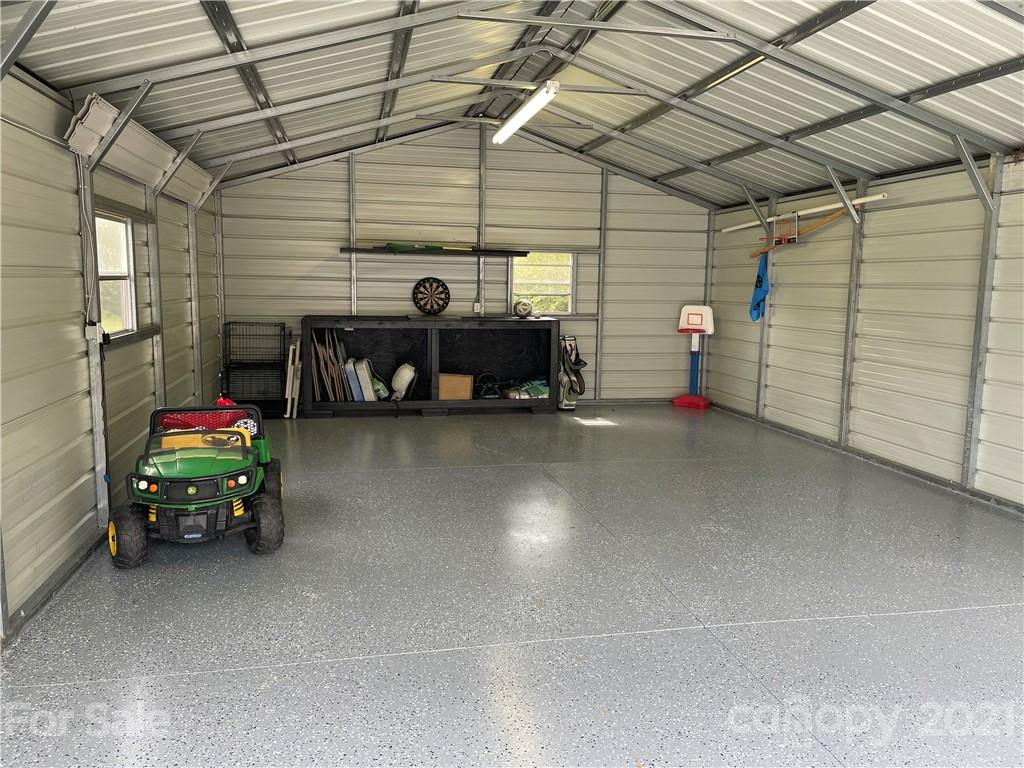 34908 Finger Road Mount Pleasant, NC 28124 - Photo 14 of 14 a view of a garage with parked cars