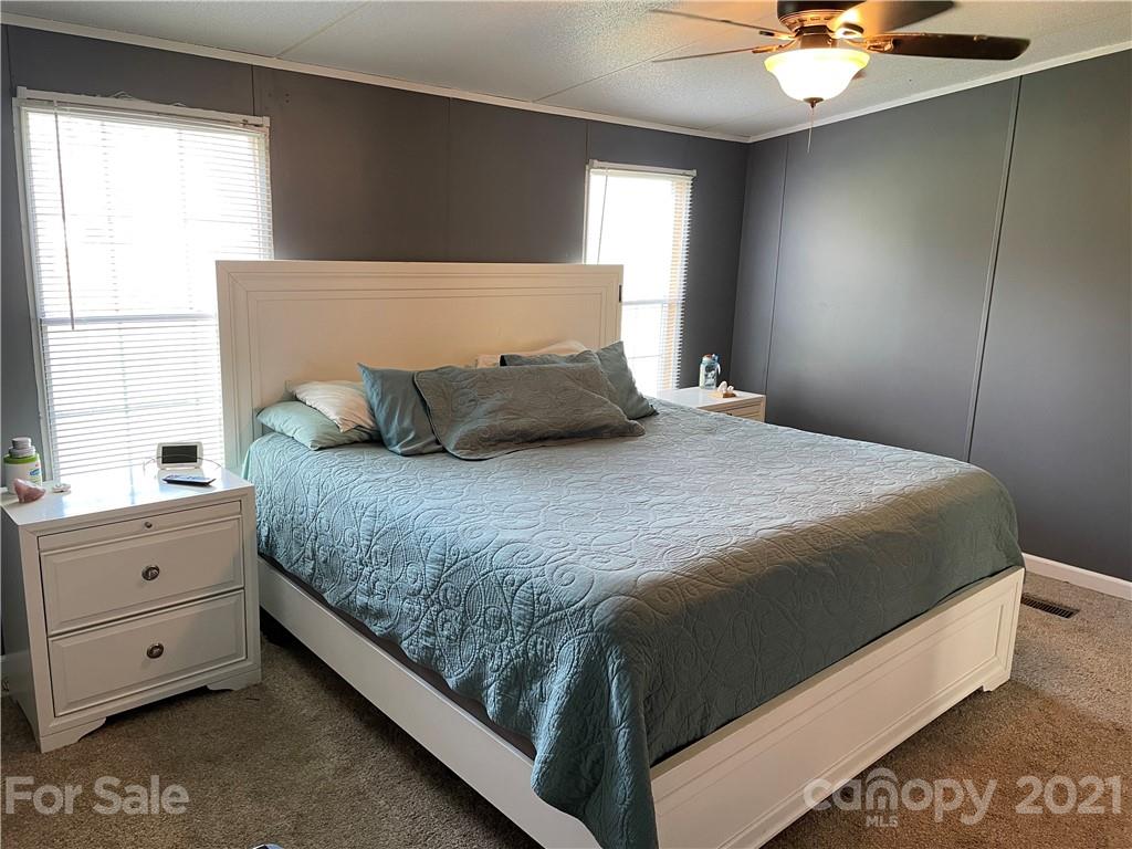 34908 Finger Road Mount Pleasant, NC 28124 - Photo 6 of 14 a bedroom with a bed and window