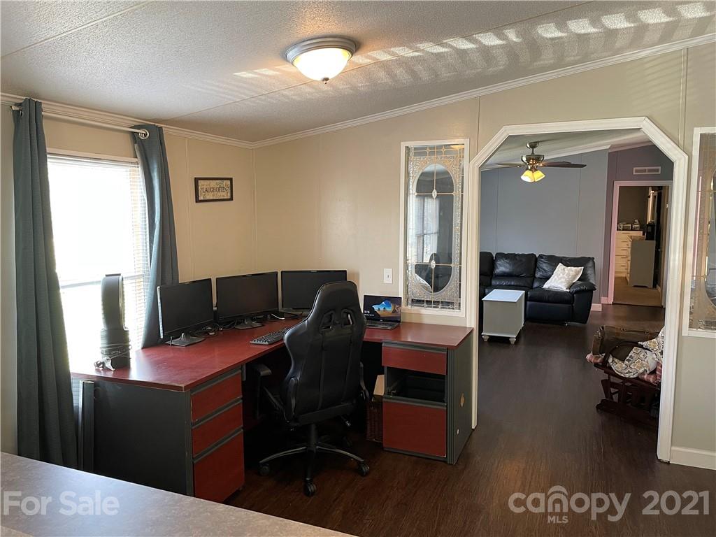 34908 Finger Road Mount Pleasant, NC 28124 - Photo 9 of 14 a view of a workspace with furniture and a window