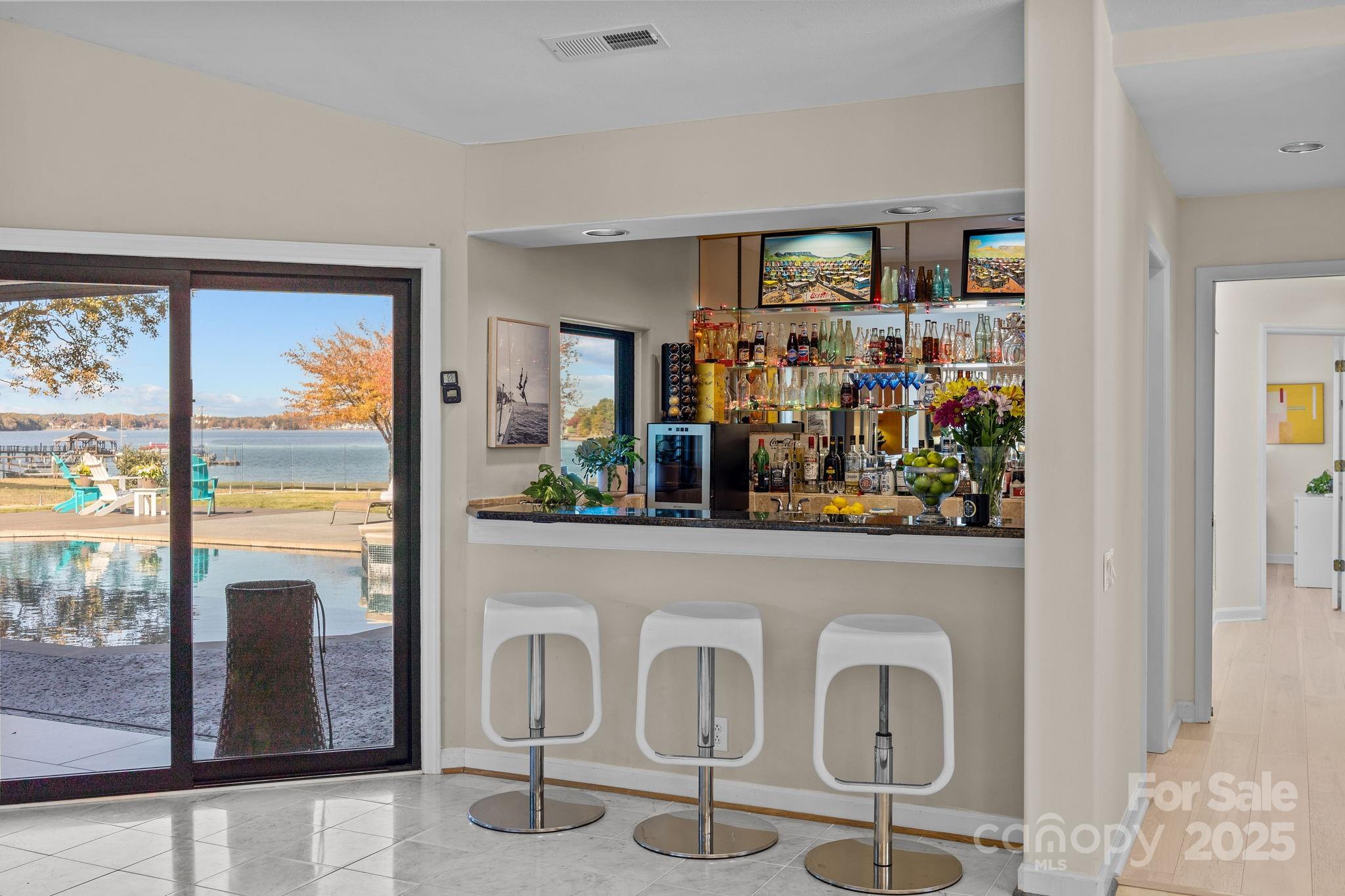 21400 Bethel Church Road Cornelius, NC 28031 - Photo 26 of 47 a view of a dining room with furniture a chandelier and window