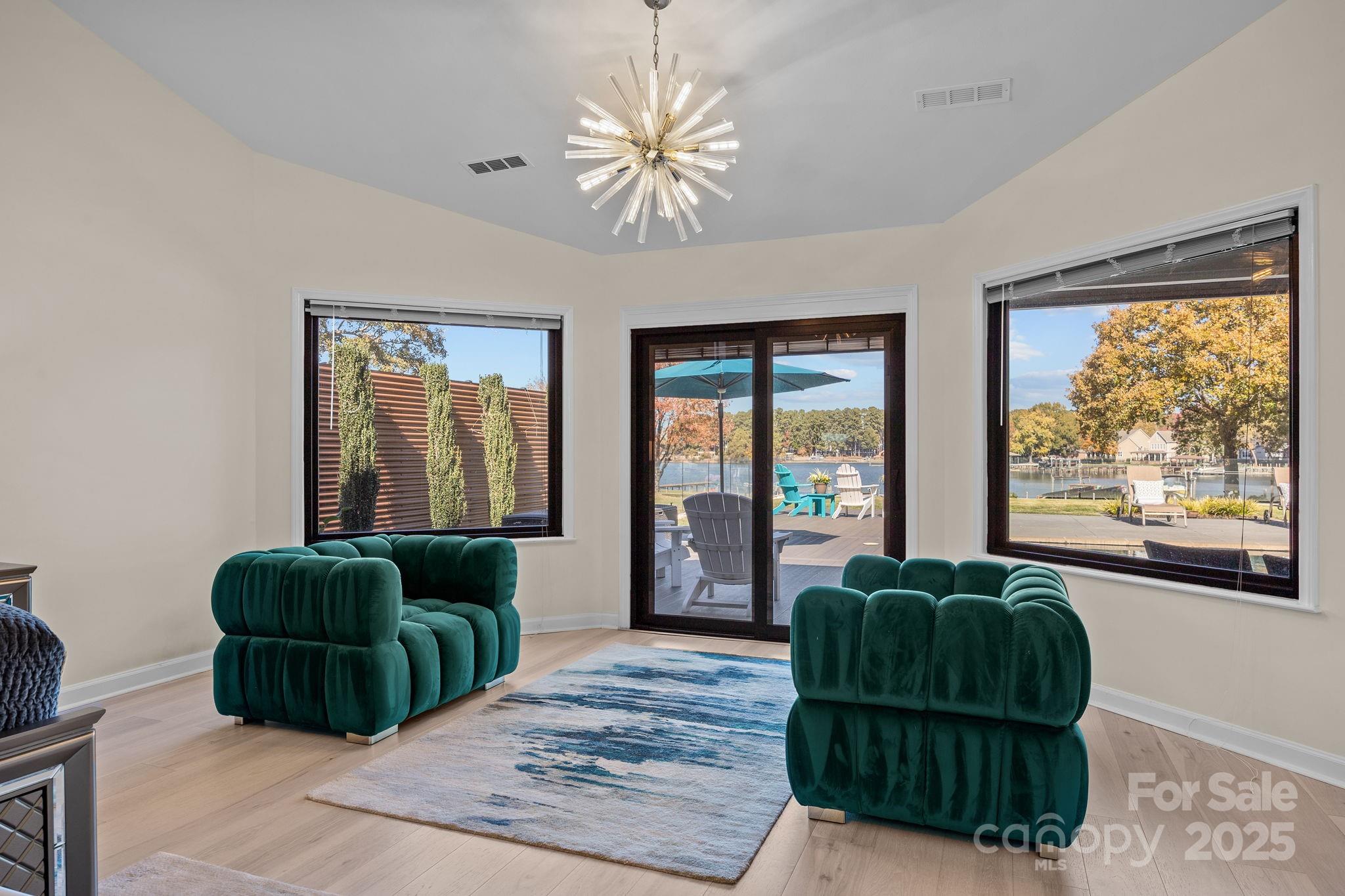 21400 Bethel Church Road Cornelius, NC 28031 - Photo 28 of 47 a living room with furniture and a large window