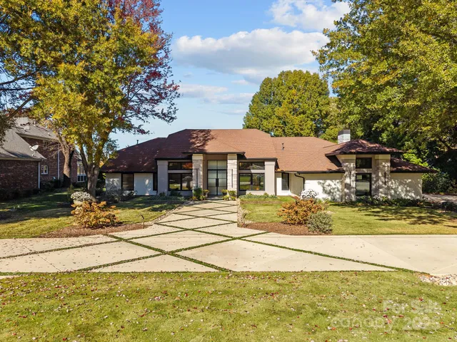 a view of a house with basketball court